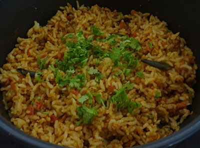 mixing tomato bath or tomato rice