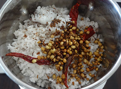 grinding coconut and spices for simple tomato rasam or saaru