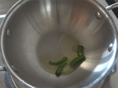 ghee and green chilli for tomato tambuli or tomato tambli