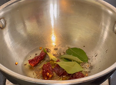 asafoetida and curry leaves for veelyadele saaru or betel leaf rasam