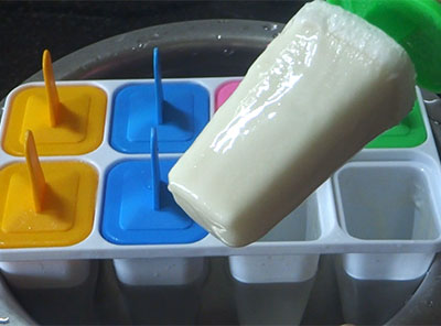 taking out wheat flour milk kulfi or doodh ice candy